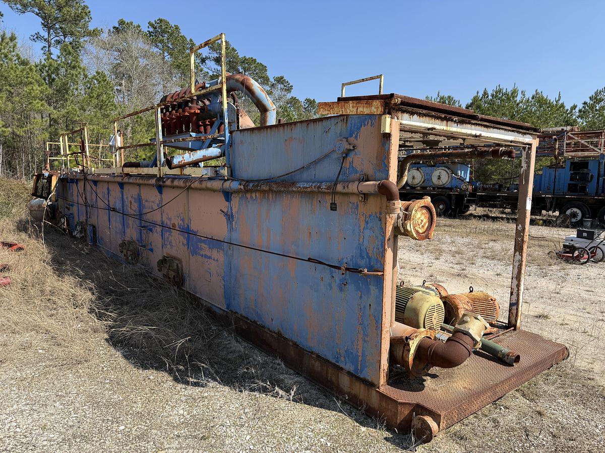 Used 40'L X 7.6'W X 5'H MUD TANK W/ 6X5 CENTRIFUGAL PUMP P/B 50-HP ELECTRIC MOTOR