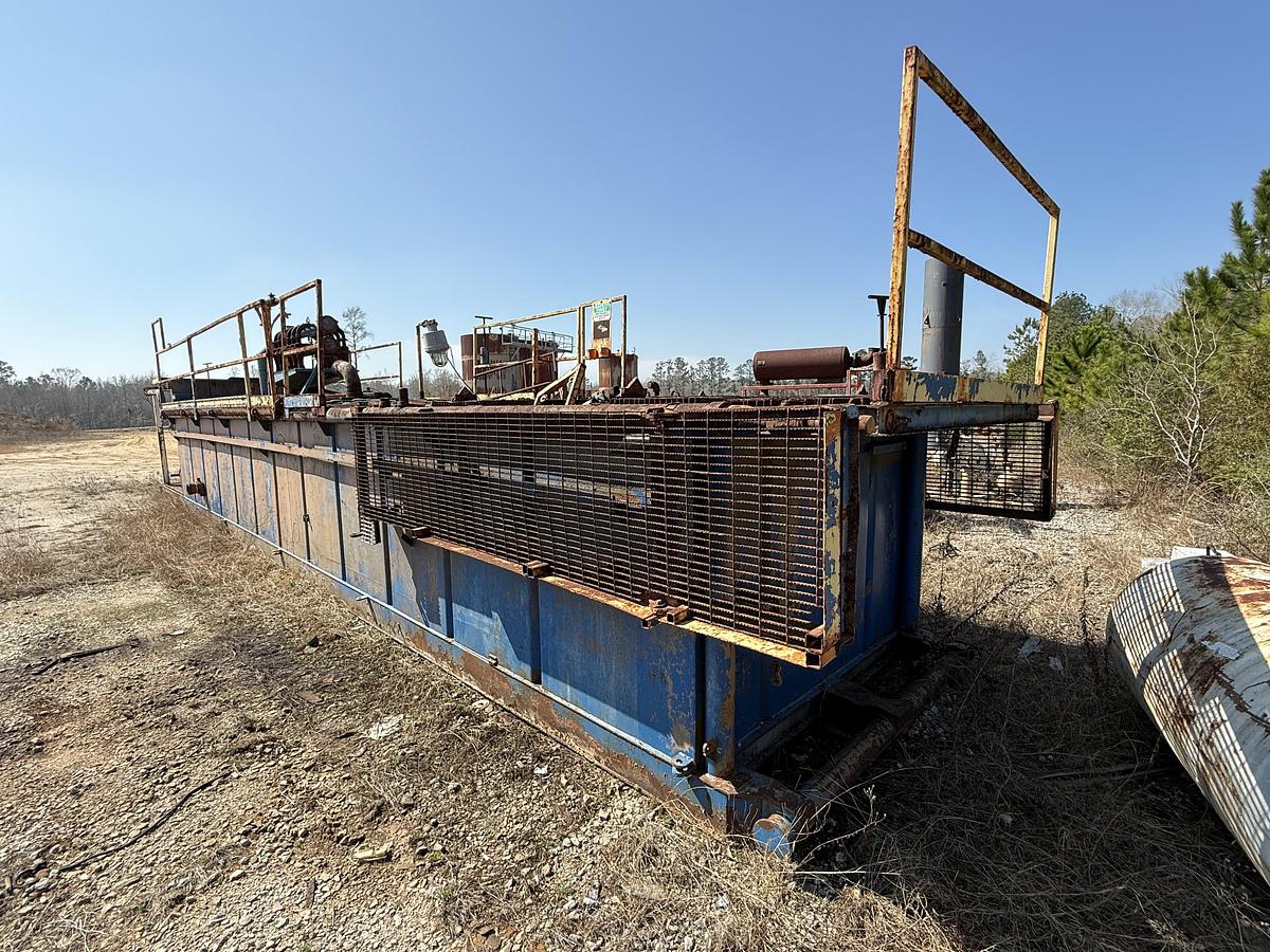 Used 40'L X 7.6'W X 5'H MUD TANK W/ 6X5 CENTRIFUGAL PUMP P/B 50-HP ELECTRIC MOTOR