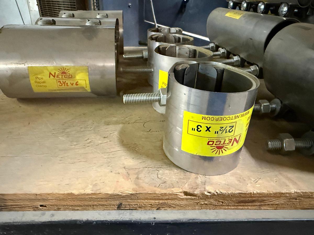 Used 5-SHELF RACK W/ CONTENTS OF PVC BALL VALVES & UNIONS, NETCO COLLAR LEAK REPAIR CLAMPS, (14+) BOXES 5/8” THRU 1” STUDS & NUTS