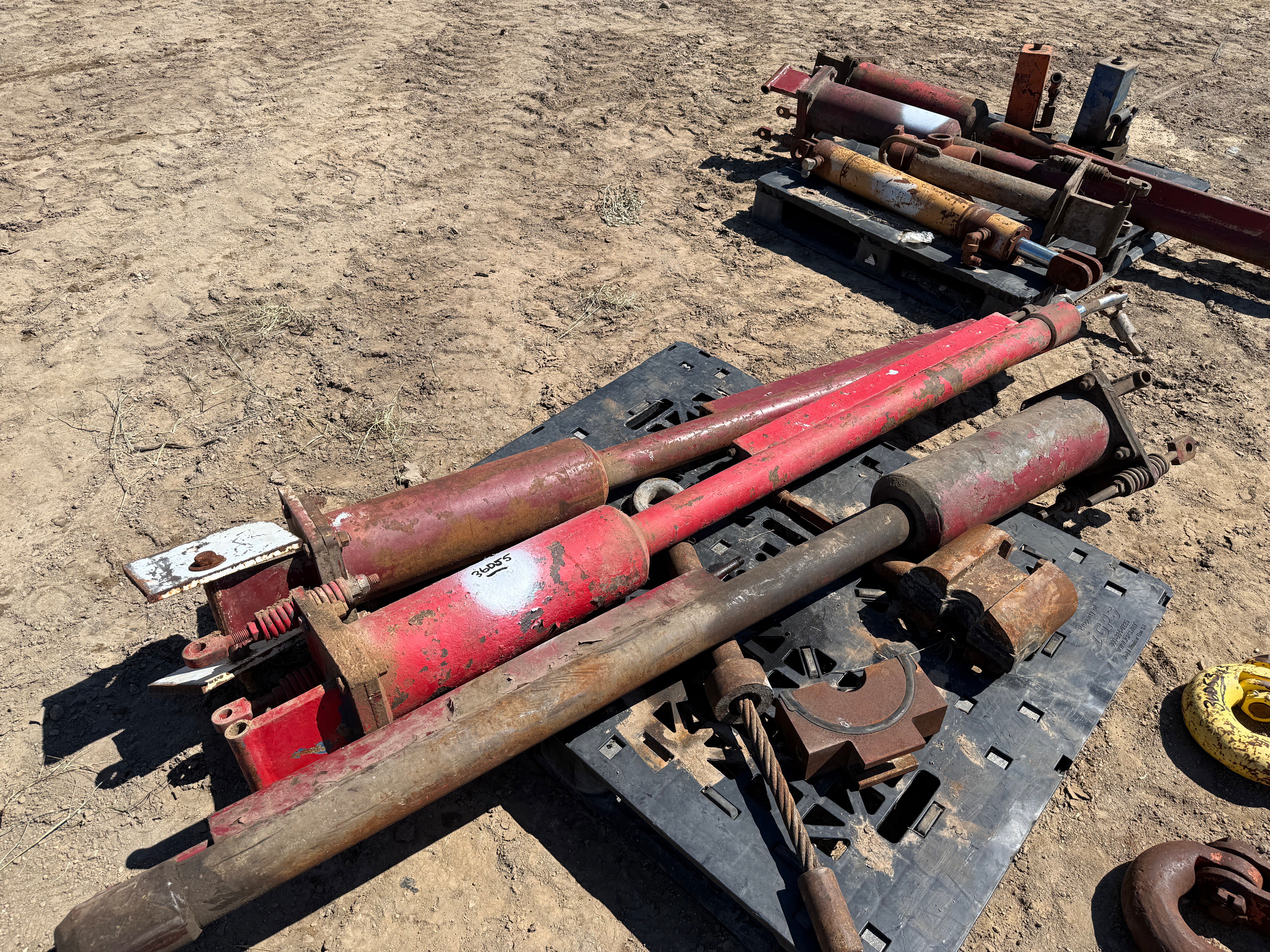 Used (2) PALLETS W/ (5) TONG LIFT CYLINDERS, TONG HANGER BRKT, (2) OIL SAVER PUMPS