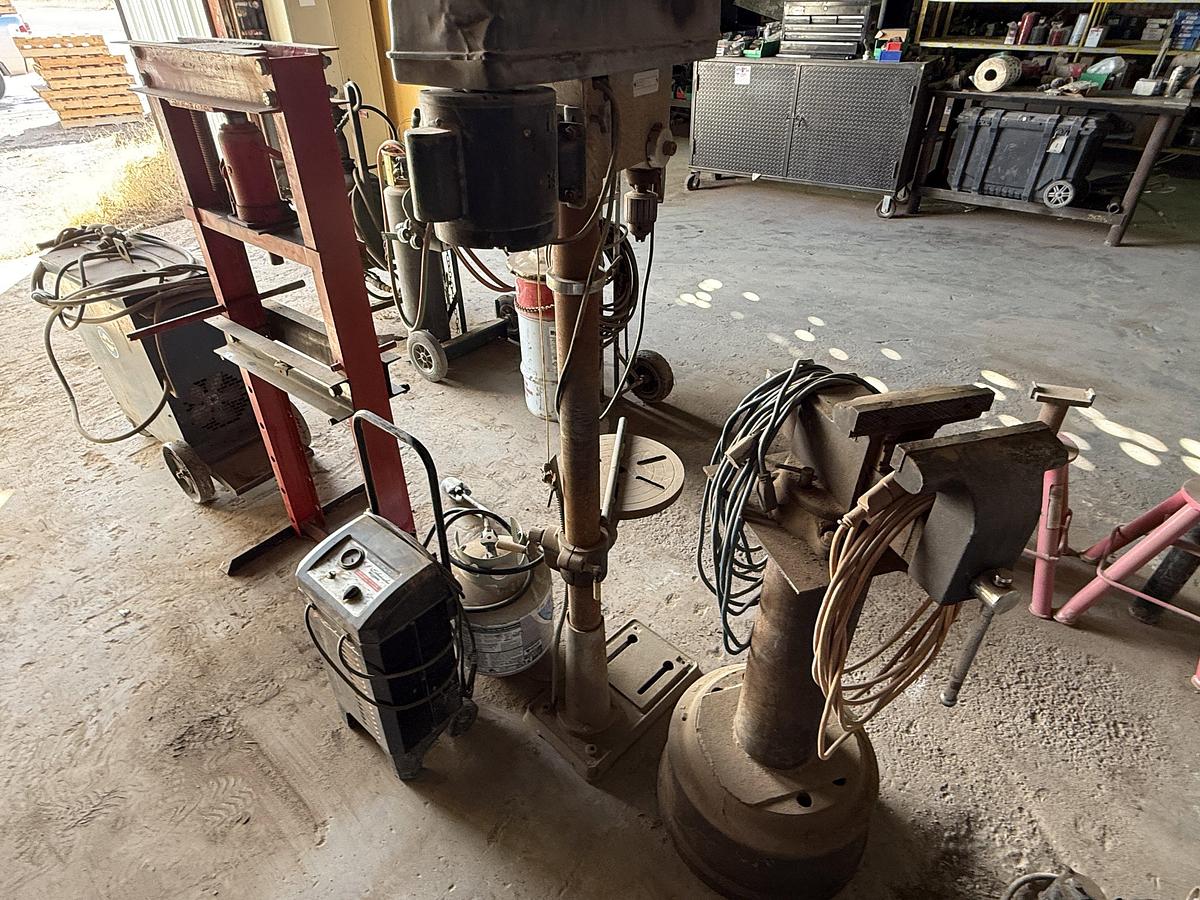 Used (1) WILTON VICE MTD ON STAND, (1) ELECT. 13” DRILL & (1) 20 TON BOTTLE JACK PRESS, (1) PROPANE BOTTLE & TORCH, BATTERY CHARGER