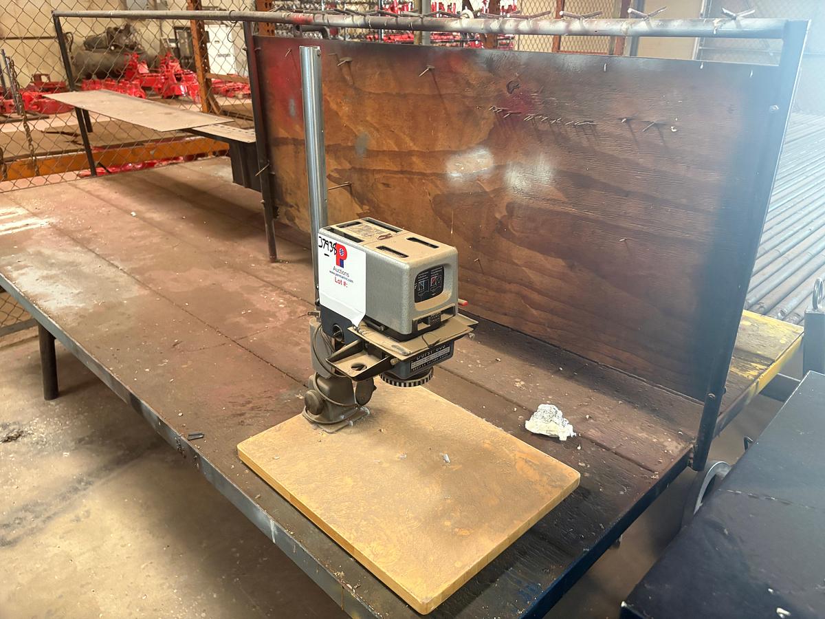 Used 10’ x 57” x 3’ shop table W/ durst 606 drill press, 4-drawer filing cabinet, & 90” x 45” storage rack