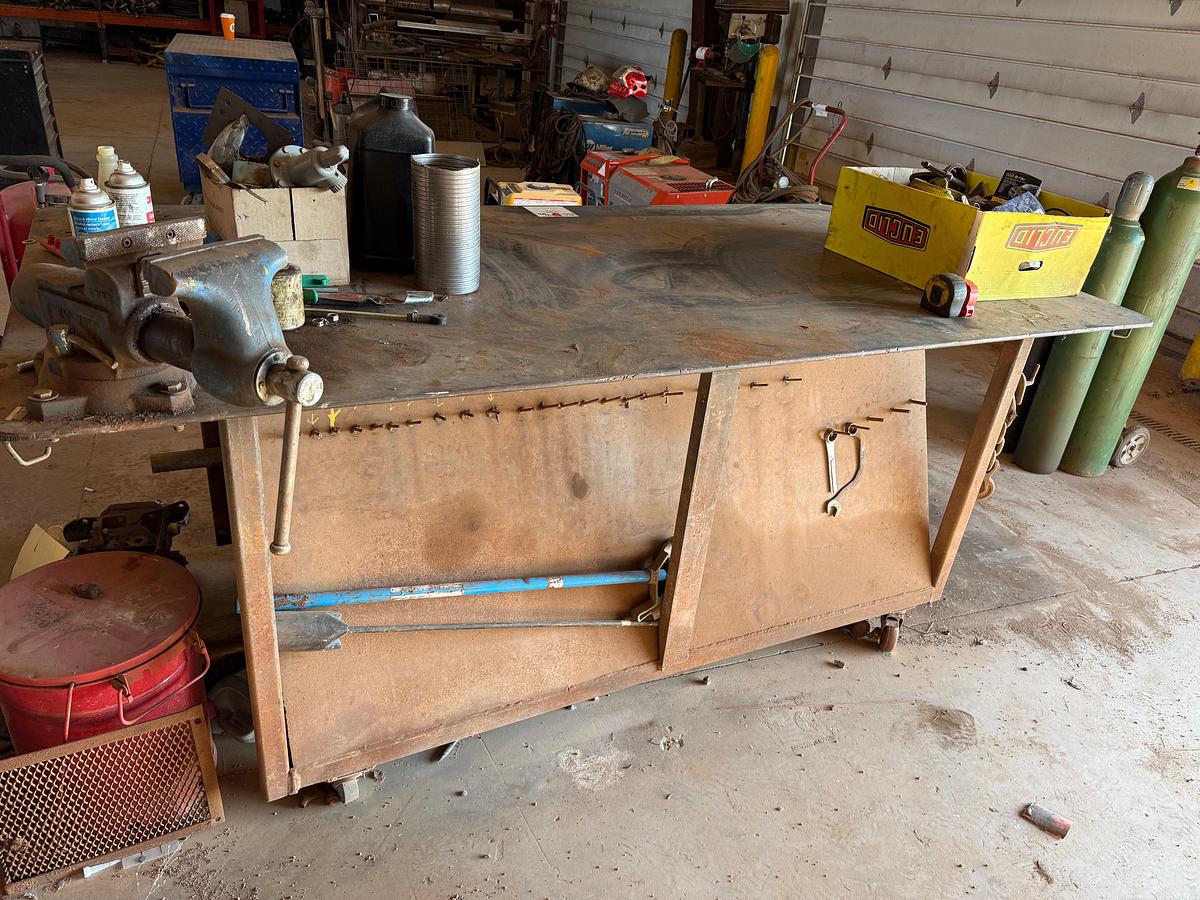 Used 8’ x 4’ x 3.4” ROLLING HD STEEL WORK TABLE W/ VICE & CONTENTS