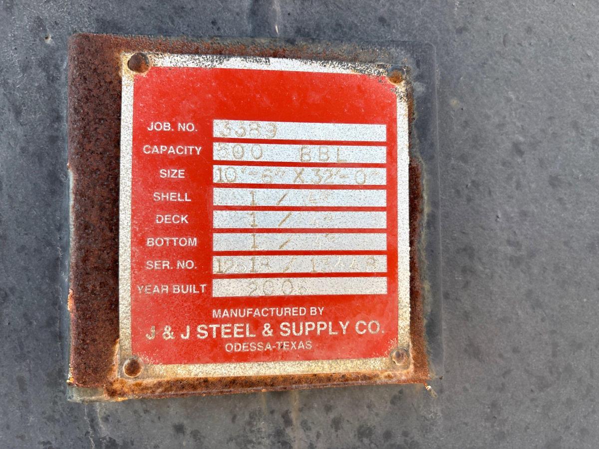 Used J&J steel 10’ 6” x 32’ 500BBL round bottom frac tank, skidded