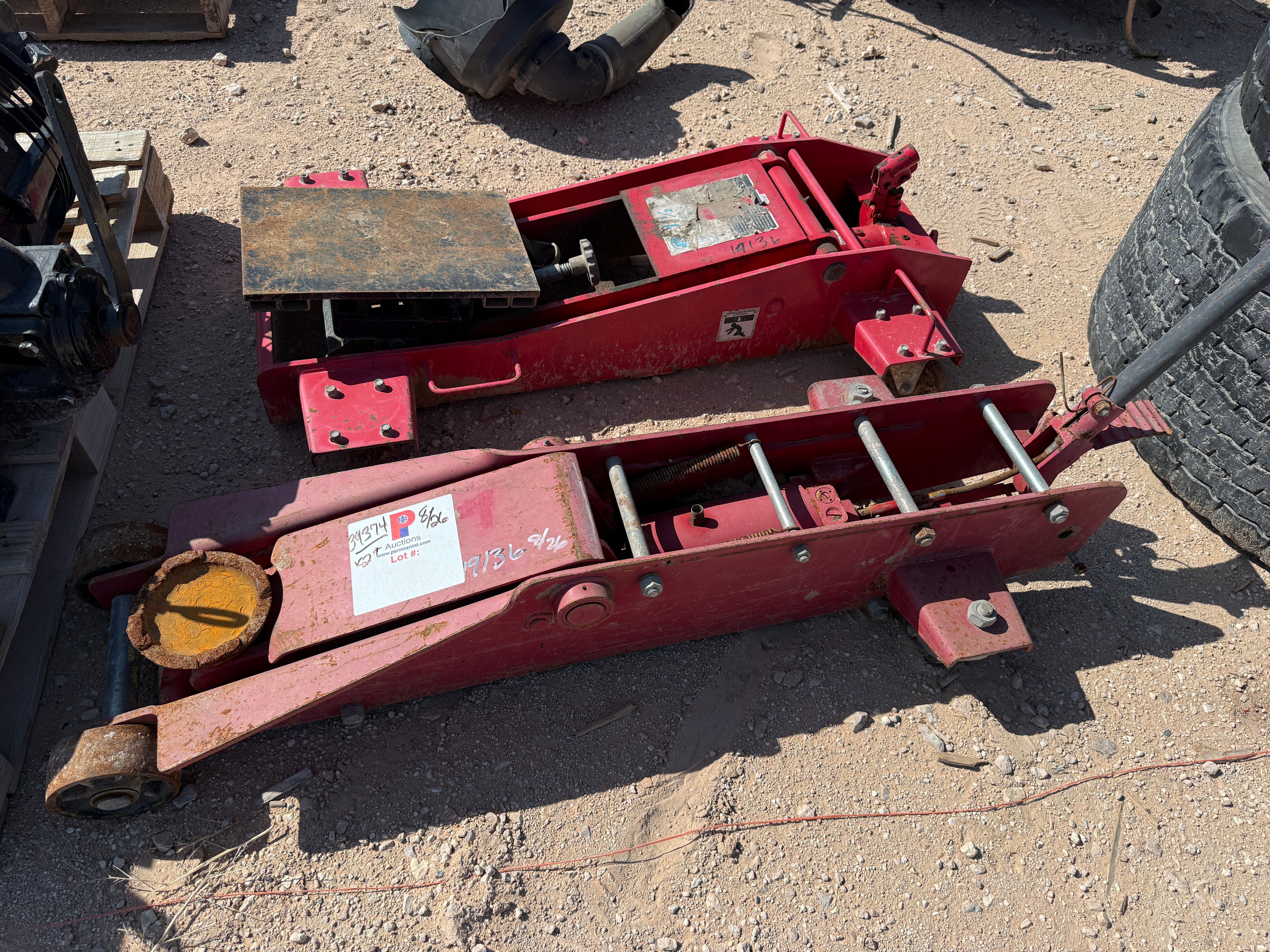 Used (1) 1-1/2 TON TRANSMISSION JACK & (1) 10-TON FLOOR JACK