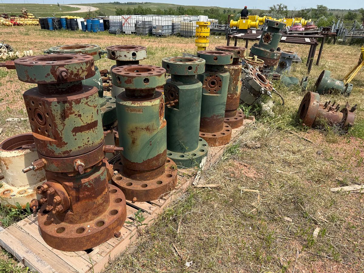 Used LOT W/ (13+) MOSTLY 7-1/16” x 2-1/16” 10M TUBING HEAD SPOOLS & RELATED, (2) TRANSPORT SKIDS  & RACKS