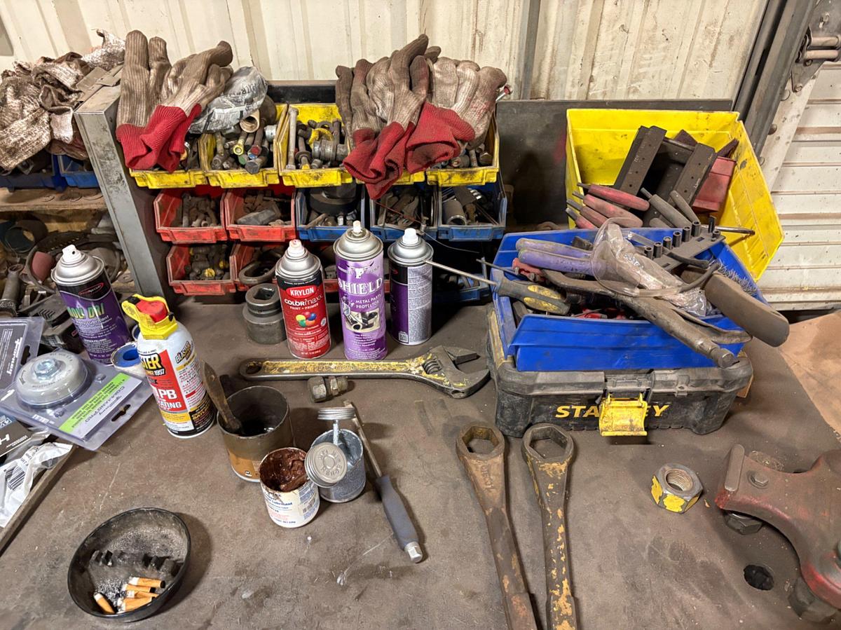 Used 10’ x 3’ x 3’ metal shop table w/ contents