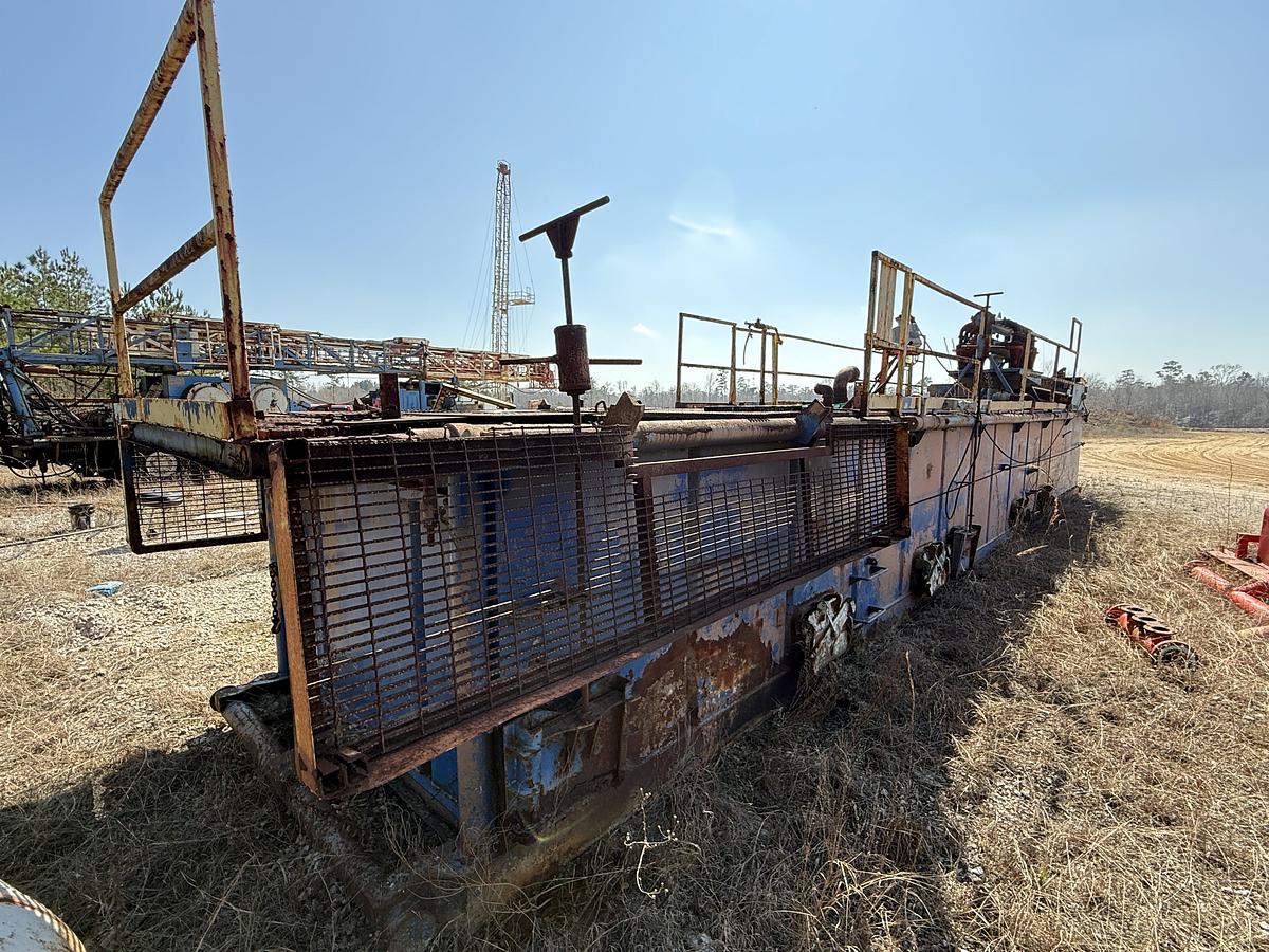 Used 40'L X 7.6'W X 5'H MUD TANK W/ 6X5 CENTRIFUGAL PUMP P/B 50-HP ELECTRIC MOTOR