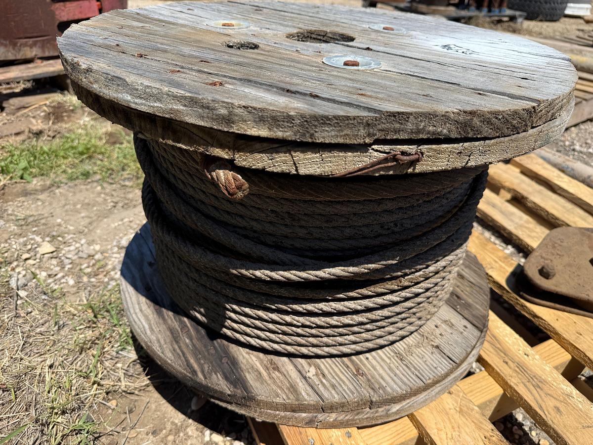 Used PALLET W/ (3) SNATCH BLOCKS & (1) SPOOL OF 1/2” WIRE ROPE