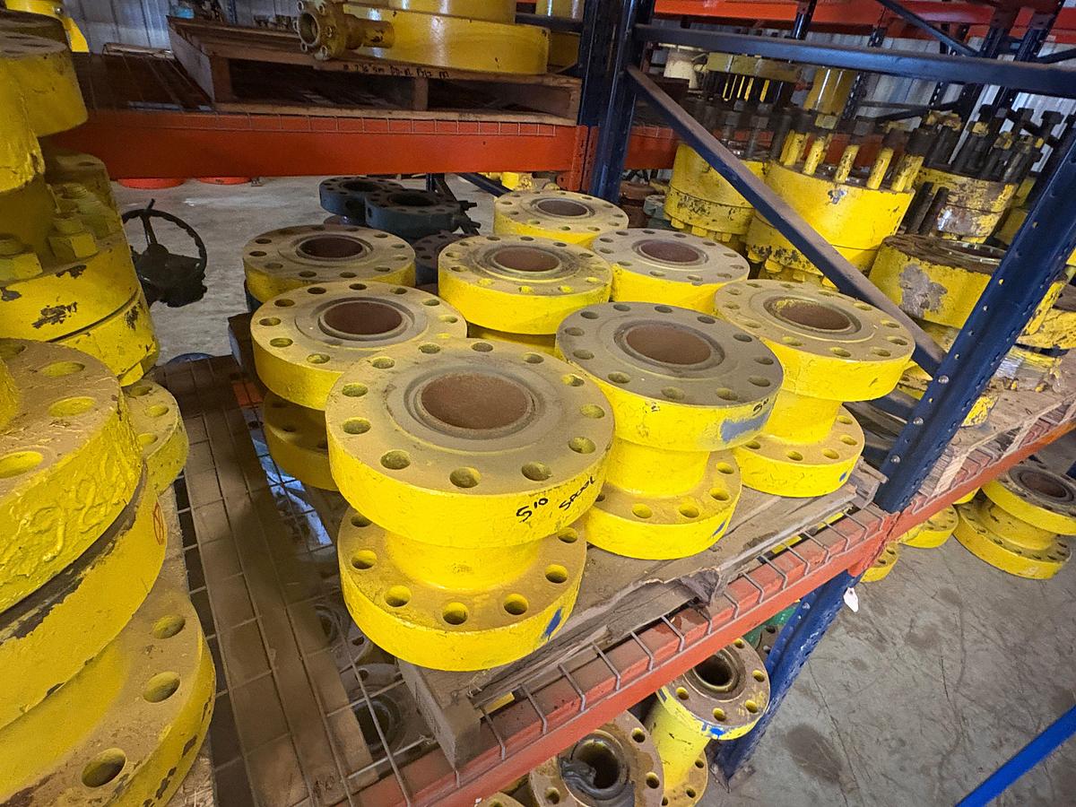 Used (25) 5” 10k spacer spools, (6) 5” 10k weco flanges, & crate w/ (8) 4” 1002 3-way fluid crosses