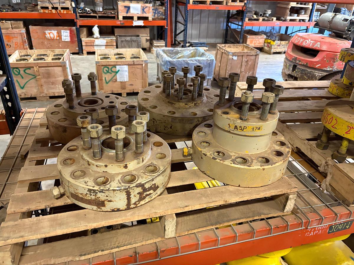 Used (4 shelves) of assorted single stud adapters, 4” to 7” spools, hydraulic valve actuators, etc