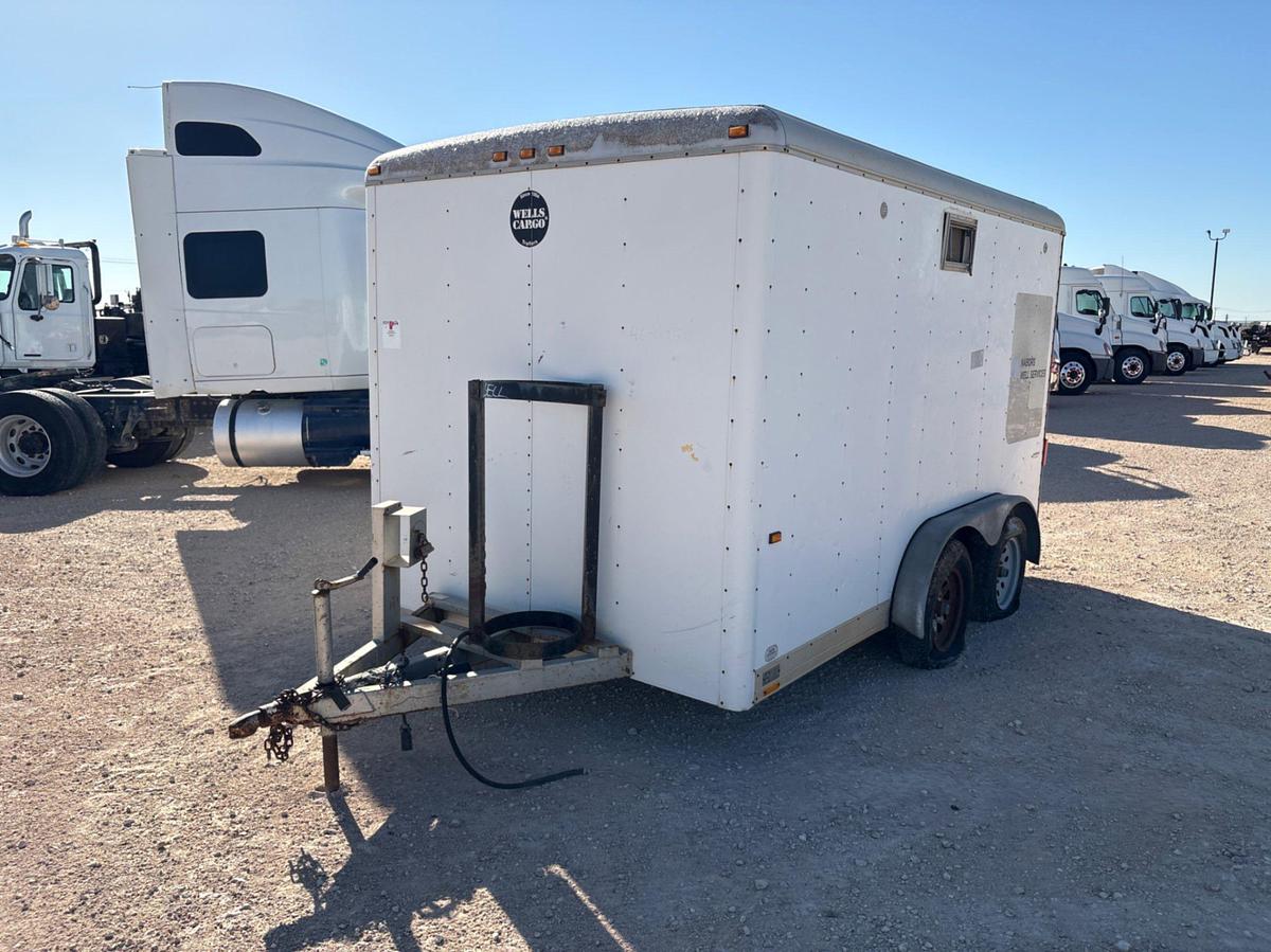 Used Wells Cargo 12’ X 7’ t/a bumper pull doghouse trailer