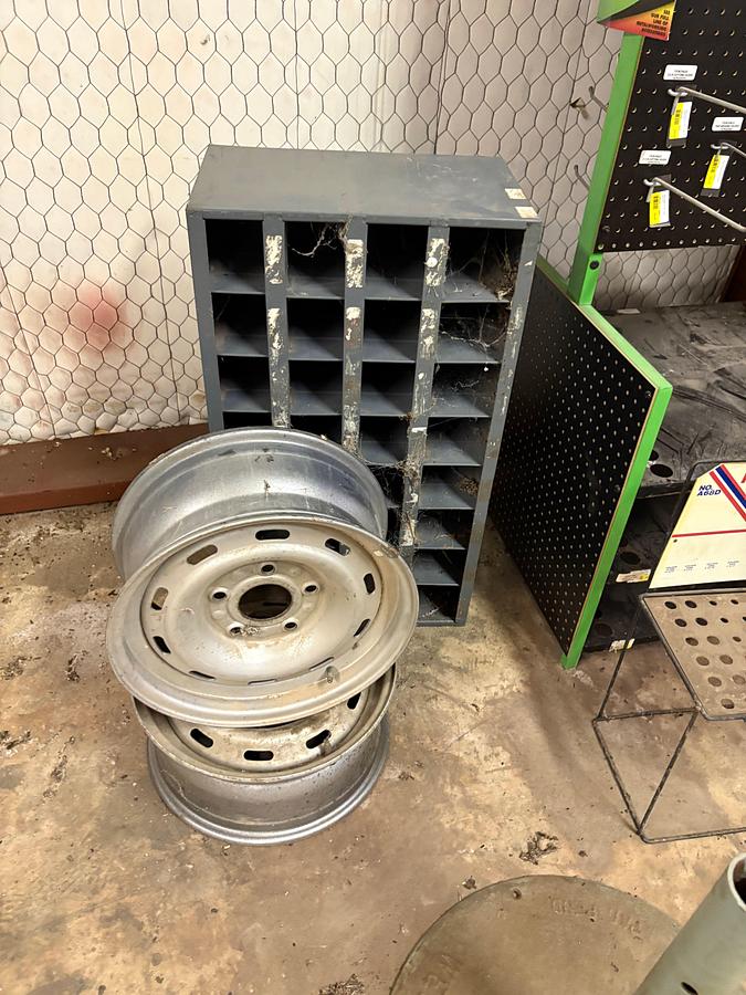 Used Display peg board, bolt bin, & (2) 5-lug wheels