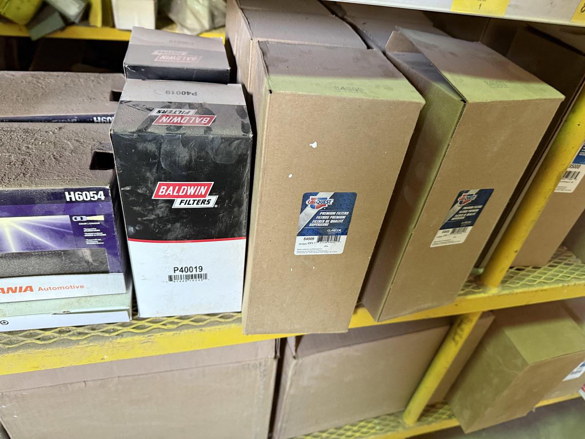 Used (2) 120”L X 24”W X 72”H 5-TIER METAL RACKS W/ TRUCK & ENGINE PARTS CONTENTS