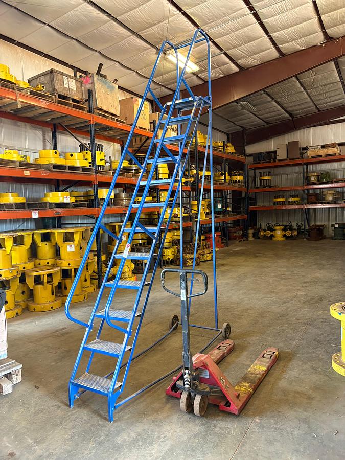 Used 7’L x 10’H portable staircase & pallet jack