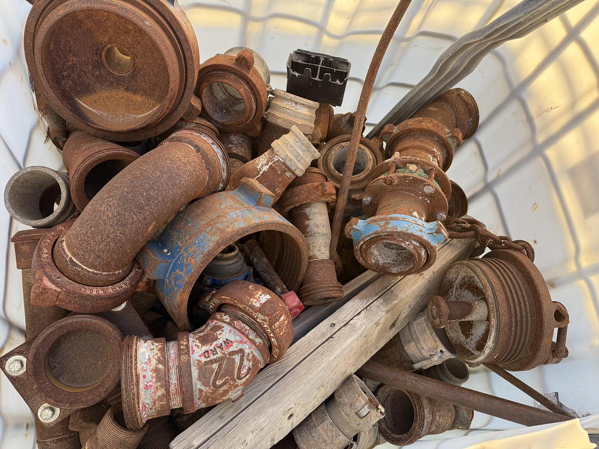 Used (1) TOTE & (1) CRATE W/ VARIOUS 2” & 3” FLOW IRON & CEMENT HEAD CONNS, CROSS OVERS, SUBS, PLUG VALVES, CHIKSANS, & RELATED