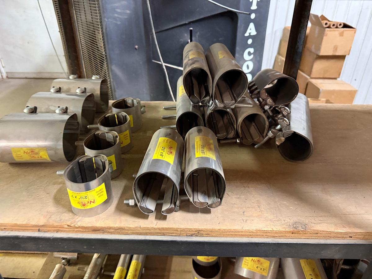 Used 5-SHELF RACK W/ CONTENTS OF PVC BALL VALVES & UNIONS, NETCO COLLAR LEAK REPAIR CLAMPS, (14+) BOXES 5/8” THRU 1” STUDS & NUTS