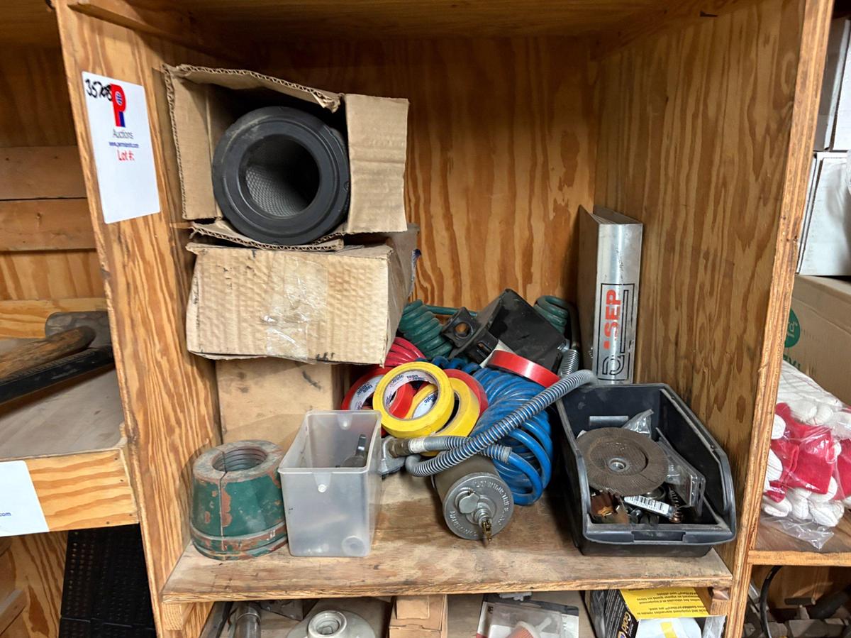 Used 2 shelves of assorted truck parts, tire chains, hand tools, etc