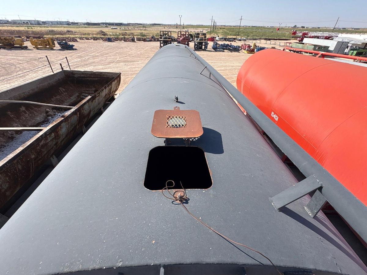 Used J&J steel 10’ 6” x 32’ 500BBL round bottom frac tank, skidded
