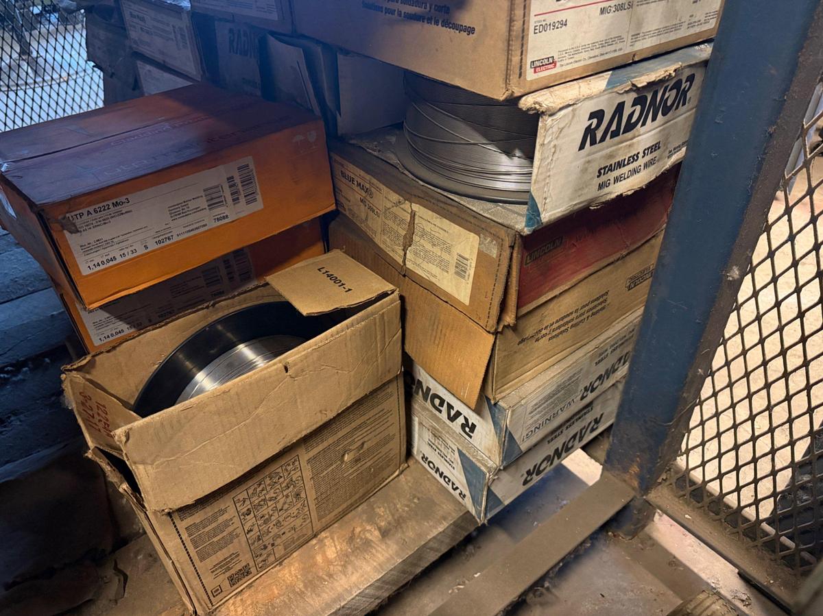 Used (3) Shelves W/ 30+ boxes of Lincoln Welding wire, New Gun Tips & Nozzles, & supplies