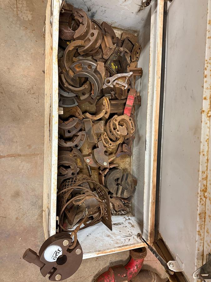 Used TOOL BOX OF VARIOUS TONG HEADS ,DIES, JAWS, INSERTS, & RELATED