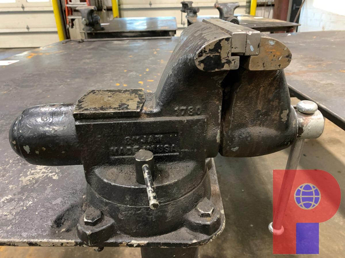 Used 8’ X 4’ STEEL TABLE W/ 8” JAW VICE