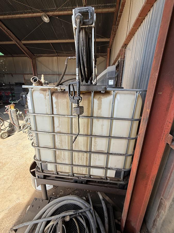 Used 44”L X 36”W X 40”H OIL TOTE W/ PNEUMATIC GUN HOSE REEL, & (2) OIL CATCH PANS