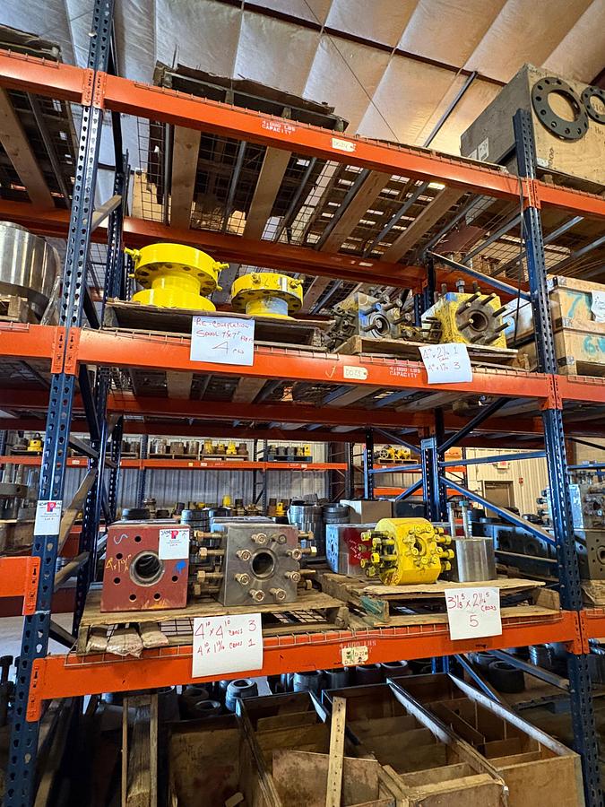 Used Contents of (2 shelves) w/ (12) assorted 1-13/16” to 4” fluid crosses, (4) 7” 5k spools, etc