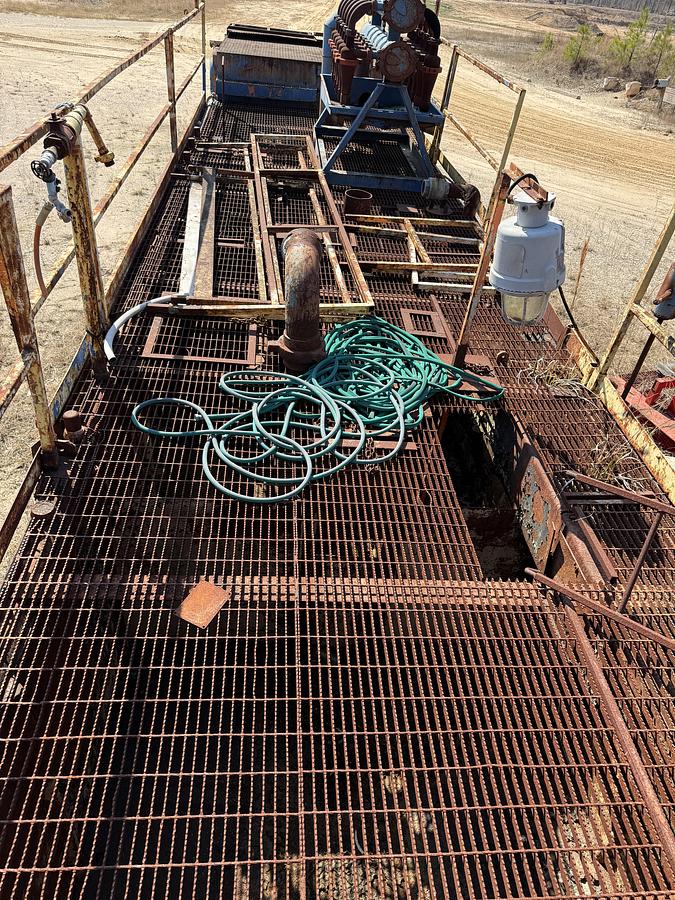 Used 40'L X 7.6'W X 5'H MUD TANK W/ 6X5 CENTRIFUGAL PUMP P/B 50-HP ELECTRIC MOTOR