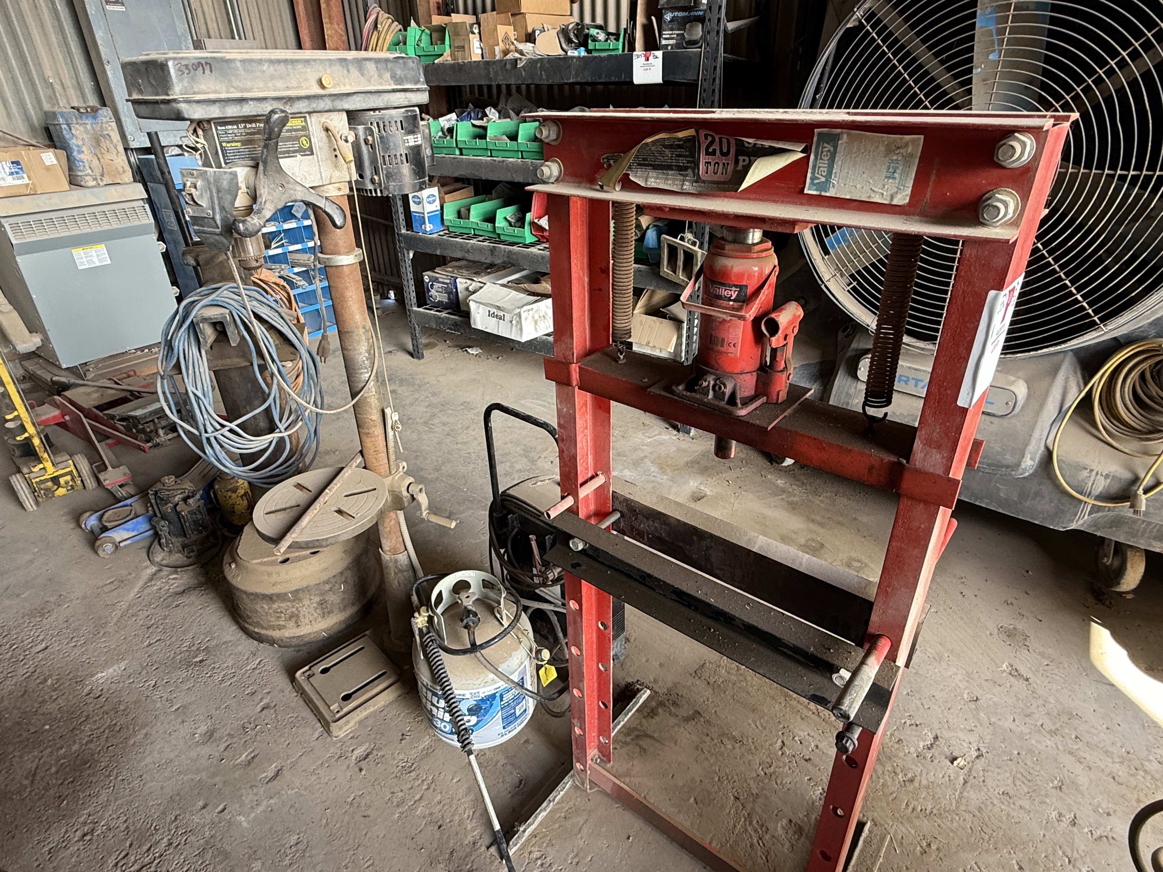 Used (1) WILTON VICE MTD ON STAND, (1) ELECT. 13” DRILL & (1) 20 TON BOTTLE JACK PRESS, (1) PROPANE BOTTLE & TORCH, BATTERY CHARGER