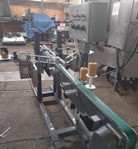 Used Universal Front and Back labeler  2" strippers