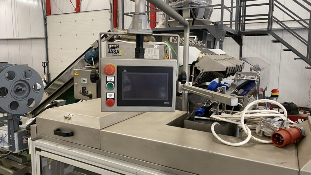 Used Newtec Htech weighing and bagging line