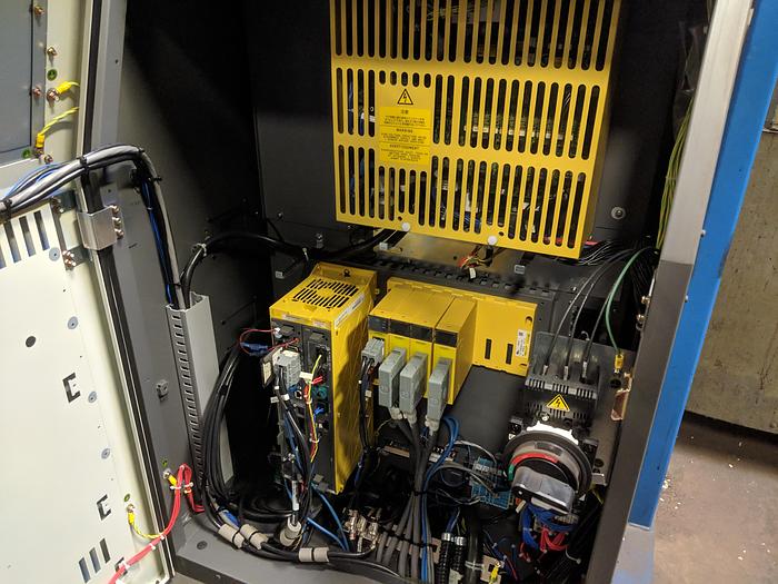 Used 2012 FANUC M710iC/50 6 AXIS ROBOT WITH IR VISION AND R30iA CONTROLLER.