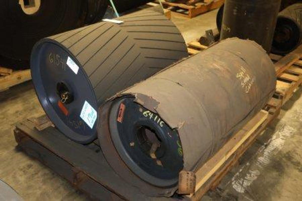 Used Conveyor pulleys. Includes (1) PCI heavy-duty pulley with chevron rubber lagging (20-3/4" Dia x 26"W) and (1) wrapped pulley (16" Dia x 32"W).