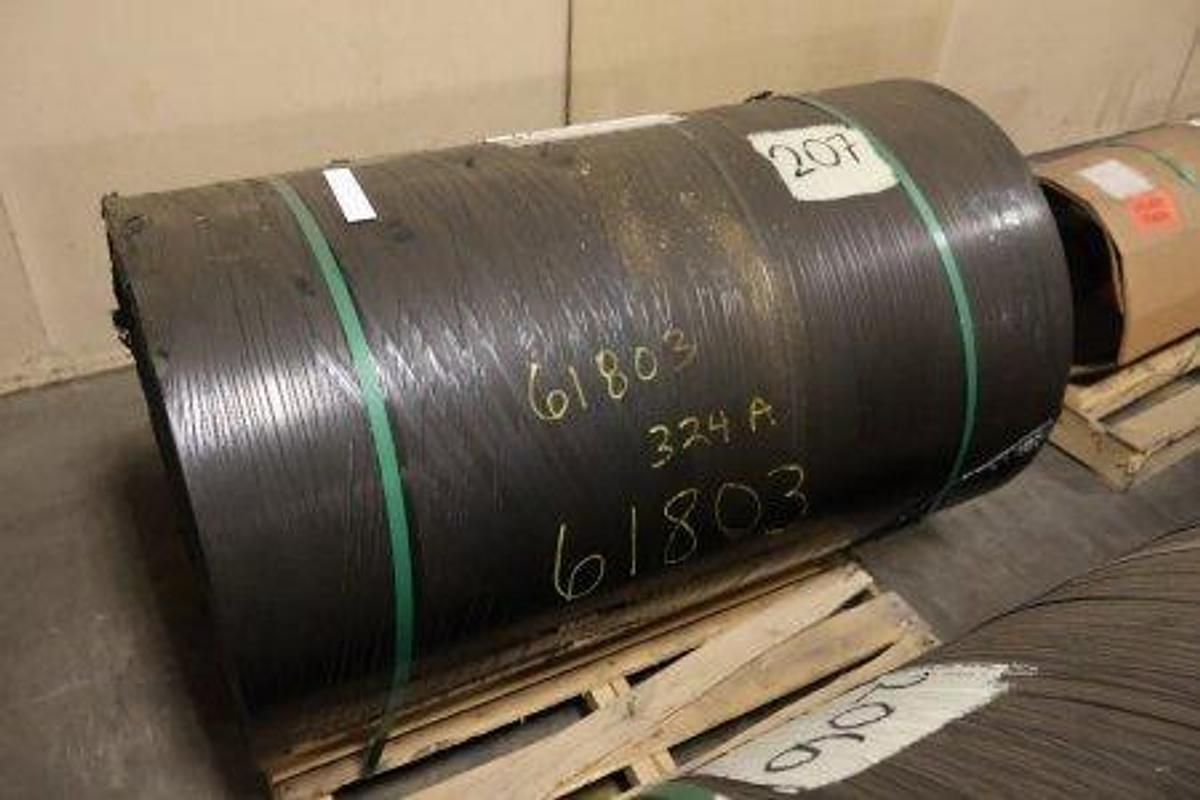 Used Price Rubber conveyor belt roll. Type: 2-P3-330. Features 1/4" x 1/16" covers. Label specifications: 48"W x 100'L. Net Weight: 1,287 lbs. Unused, mounted on pallet.
