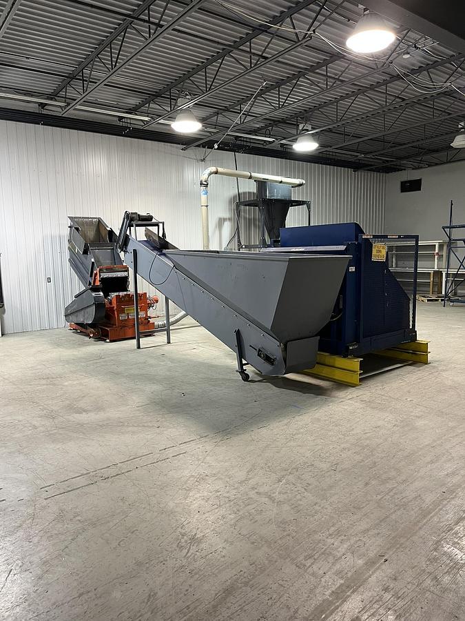 Used Complete WEIMA granulation line of 75 HP, including conveyor, tilter, blower and cyclone.