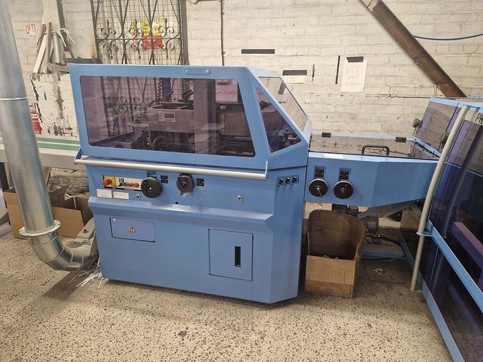 Used 2009 MULLER MARTINI E90 8 Station Chain, 8 x 1555 Feeders, 1528 Cover Feeder, E90 Stitching Unit, Three Knife Trimmer, Shingle Belt Delivery 