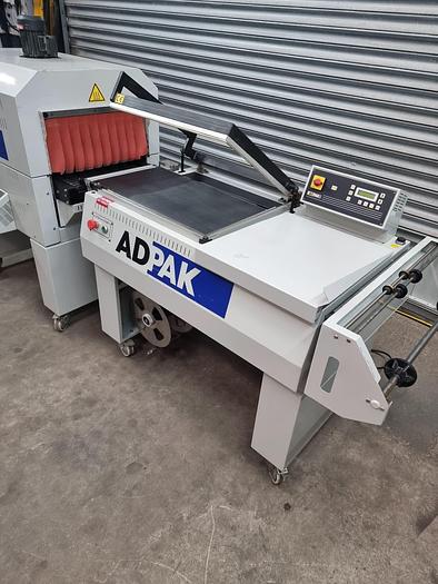 Used Adpak Fd560FA Shrink wrap machine with heat tunnel, L sealer 