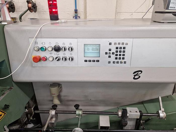 Used MULLER MARTINI BRAVO 6 Station Chain, 6 x 370 Feeders, 1 x Cover Feeder, Bravo Stitching Unit, Three Knife Trimmer, Pratico Stacker Delivery