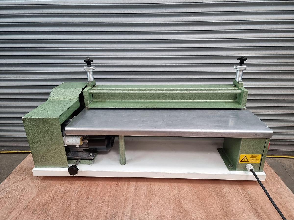 Used sumbel regent 650 enrobing and laminating operations. For fast, clean and even pressing of book covers