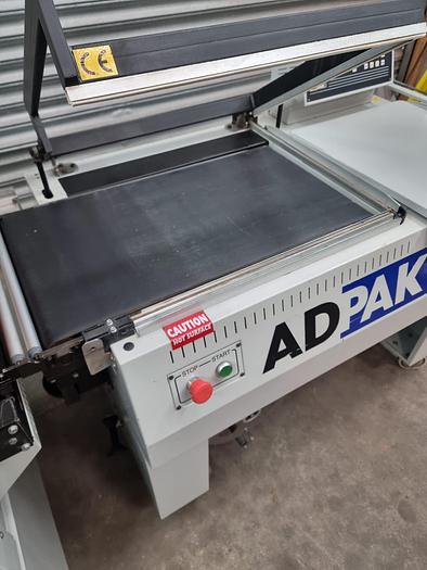Used Adpak Fd560FA Shrink wrap machine with heat tunnel, L sealer 