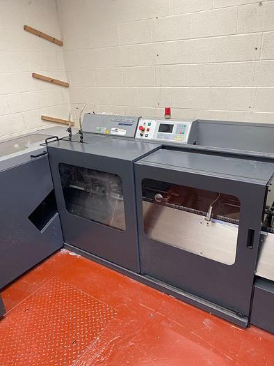 Used HEIDELBERG ST100 6 Station Chain, 6 x Auto Feeders, 1 x Cover Feeder, ST100 Stitching Unit, Three Knife Trimmer, Rima Stacker Delivery