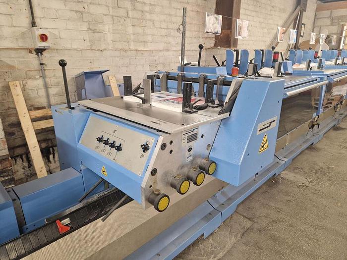 Used 2009 MULLER MARTINI E90 8 Station Chain, 8 x 1555 Feeders, 1528 Cover Feeder, E90 Stitching Unit, Three Knife Trimmer, Shingle Belt Delivery 