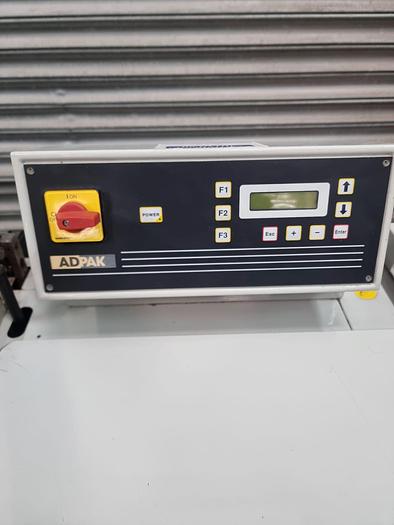 Used Adpak Fd560FA Shrink wrap machine with heat tunnel, L sealer 