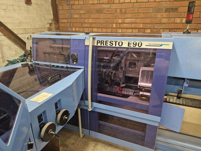 Used 2009 MULLER MARTINI E90 8 Station Chain, 8 x 1555 Feeders, 1528 Cover Feeder, E90 Stitching Unit, Three Knife Trimmer, Shingle Belt Delivery 