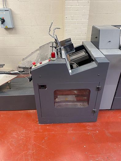 Used HEIDELBERG ST100 6 Station Chain, 6 x Auto Feeders, 1 x Cover Feeder, ST100 Stitching Unit, Three Knife Trimmer, Rima Stacker Delivery