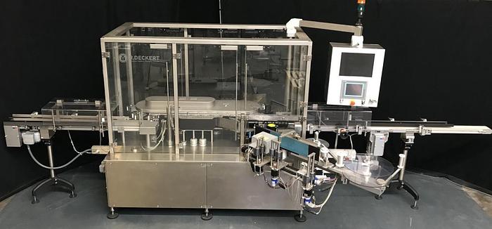 Used M 157836 D - Round bottle labeller DECKERT DEM 1000+