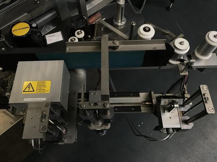 Used M 157836 D - Round bottle labeller DECKERT DEM 1000+