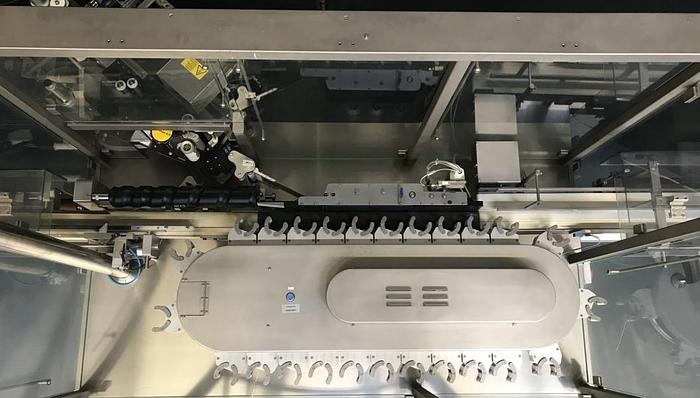 Used M 157836 D - Round bottle labeller DECKERT DEM 1000+