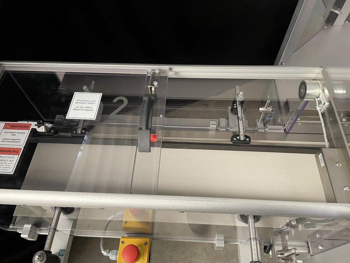 Used O 17302 D - full wrapping machine with PEWO-COLLECT grouping table PESTER PEWOFOLD 2